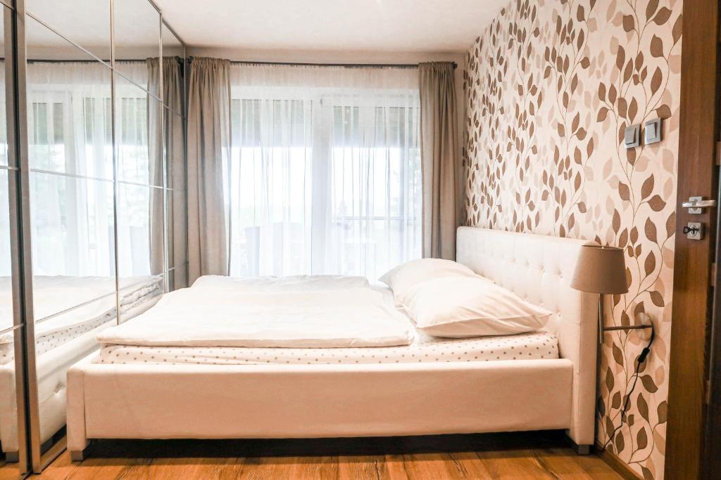 Postel nebo postele na pokoji v ubytování Sweet Home