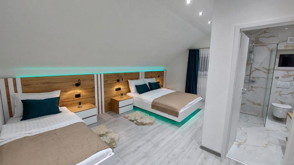 Posteľ alebo postele v izbe v ubytovaní Premier House by RD Group
