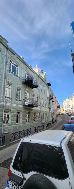 a white car parked in front of a building at apartament in old Tbilisi in Tbilisi City