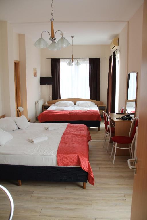 Postel nebo postele na pokoji v ubytování Hotel Rose City
