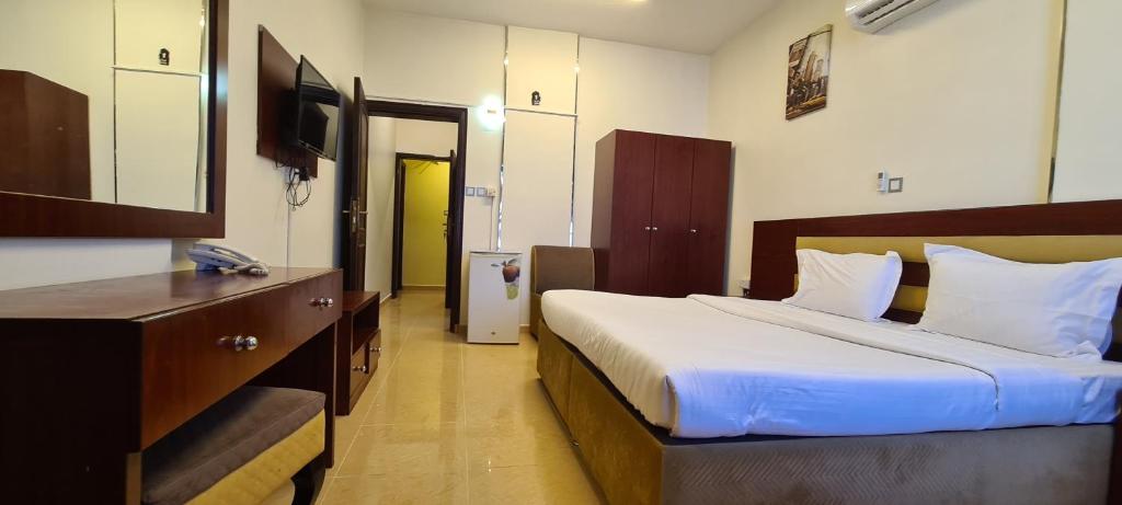 Postel nebo postele na pokoji v ubytování AL AMAN HOTEL