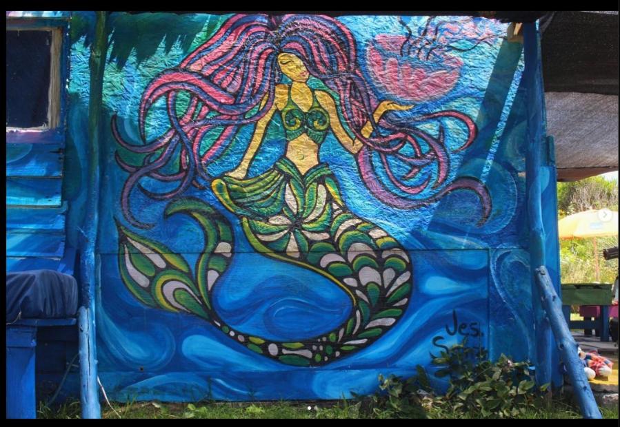 a painting of a mermaid on a play structure at Darwin Hostel in Cabo Polonio