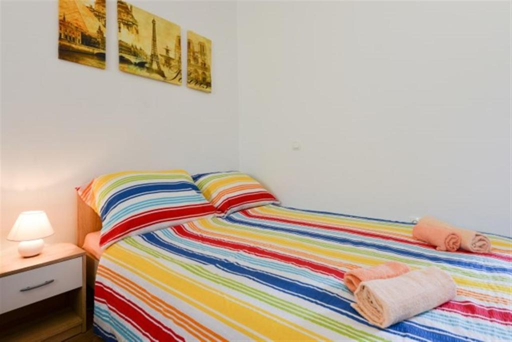 Posteľ alebo postele v izbe v ubytovaní Studios Villa Romantica