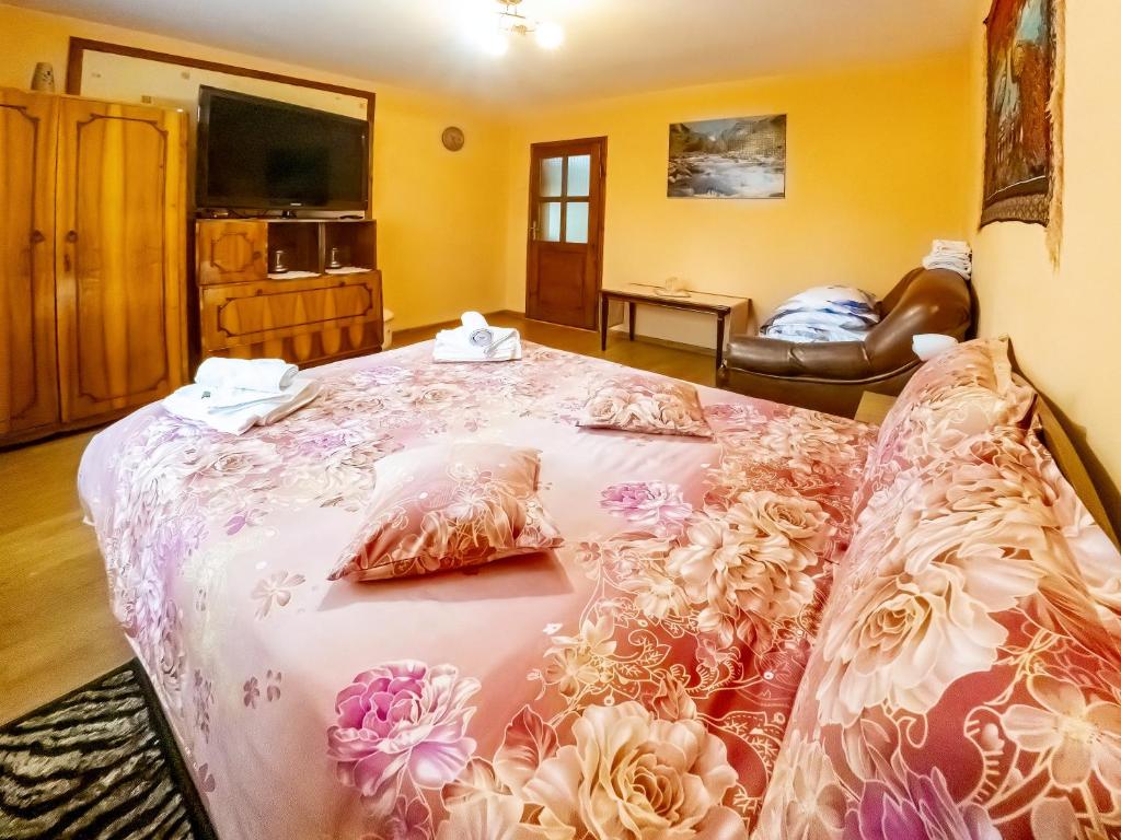 Postel nebo postele na pokoji v ubytování Casa Ionela