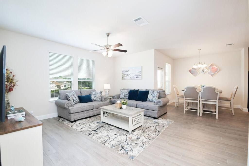 a living room with a couch and a table at Texas Luxury Home 3 in San Antonio