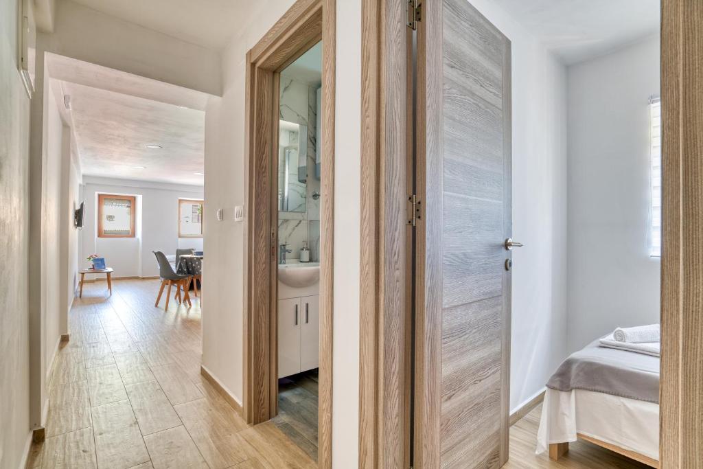 Postel nebo postele na pokoji v ubytování Apartments Pavic