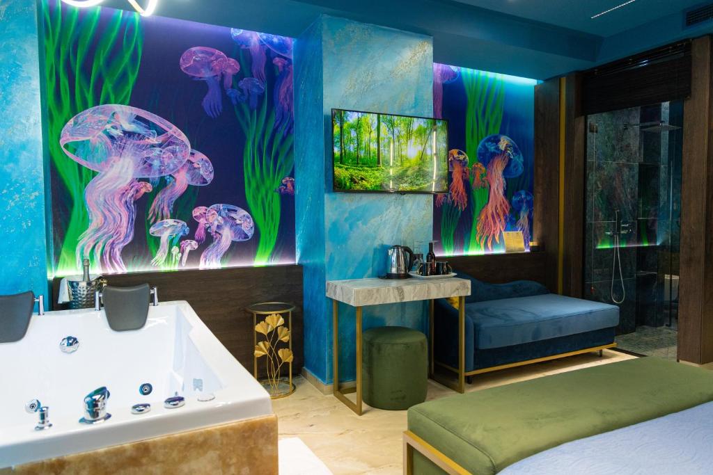 Telewizja i/lub zestaw kina domowego w obiekcie Mustafa Suites