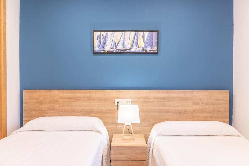Posteľ alebo postele v izbe v ubytovaní Apartamentos Rurales de Abelleira