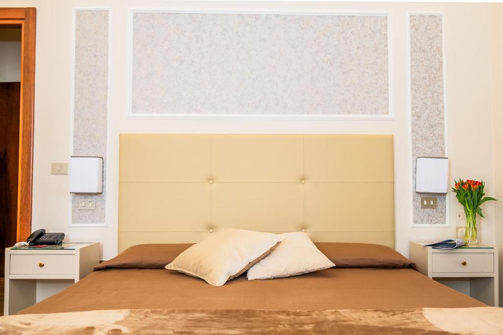 Postel nebo postele na pokoji v ubytování Hotel Ariston & Spa