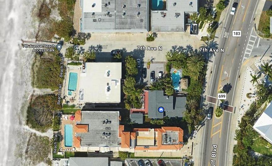 an overhead view of a house with a street at Beachside Historic Cottage - Steps to Sand! in Clearwater Beach