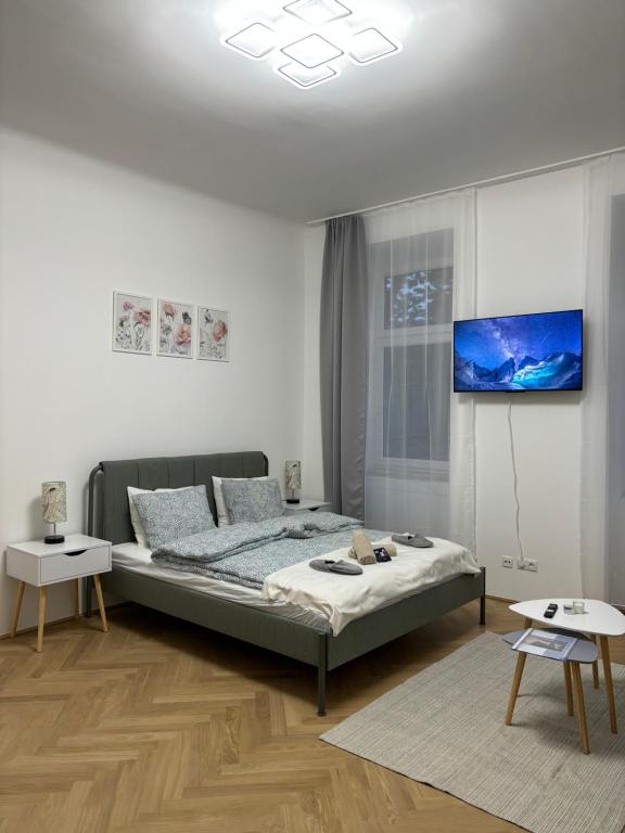 a bedroom with a bed in a white room at Apartment Vienna in Vienna