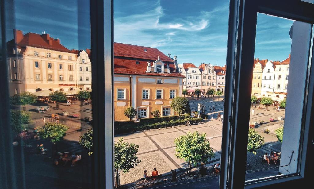 a view of a city from a window at Apartamenty przy Ratuszu in Bolesławiec
