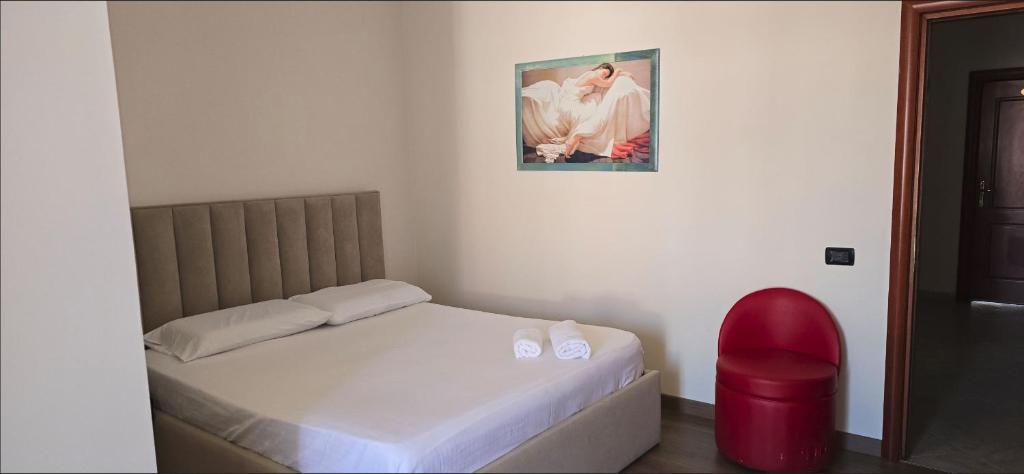 Postel nebo postele na pokoji v ubytování KOA Hotel Tiranë