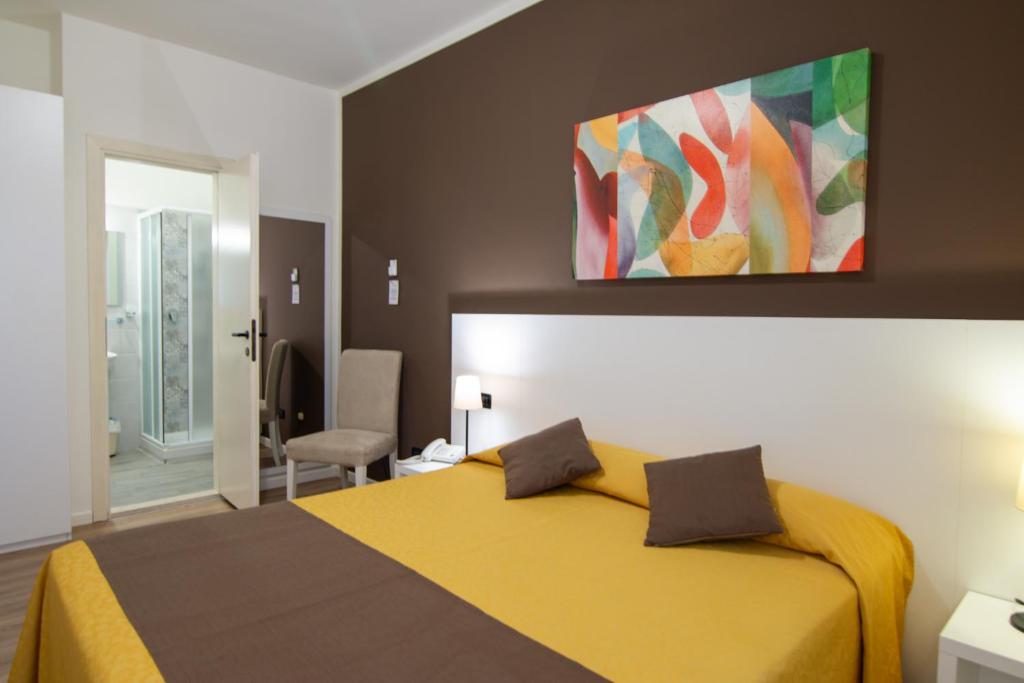Postel nebo postele na pokoji v ubytování Hotel Eden Salò