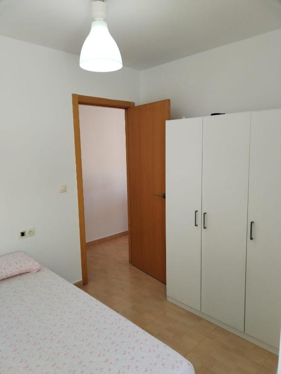 Postel nebo postele na pokoji v ubytování Habitación Ático Sol y Mar