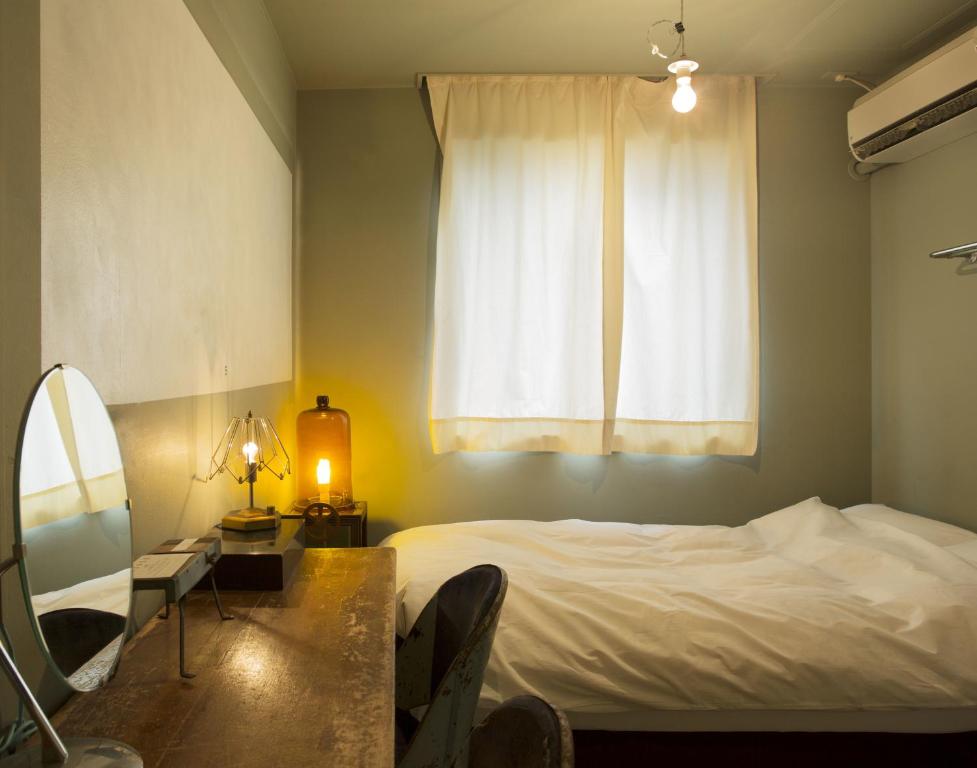 Postel nebo postele na pokoji v ubytování Apartment Hotel Shinjuku