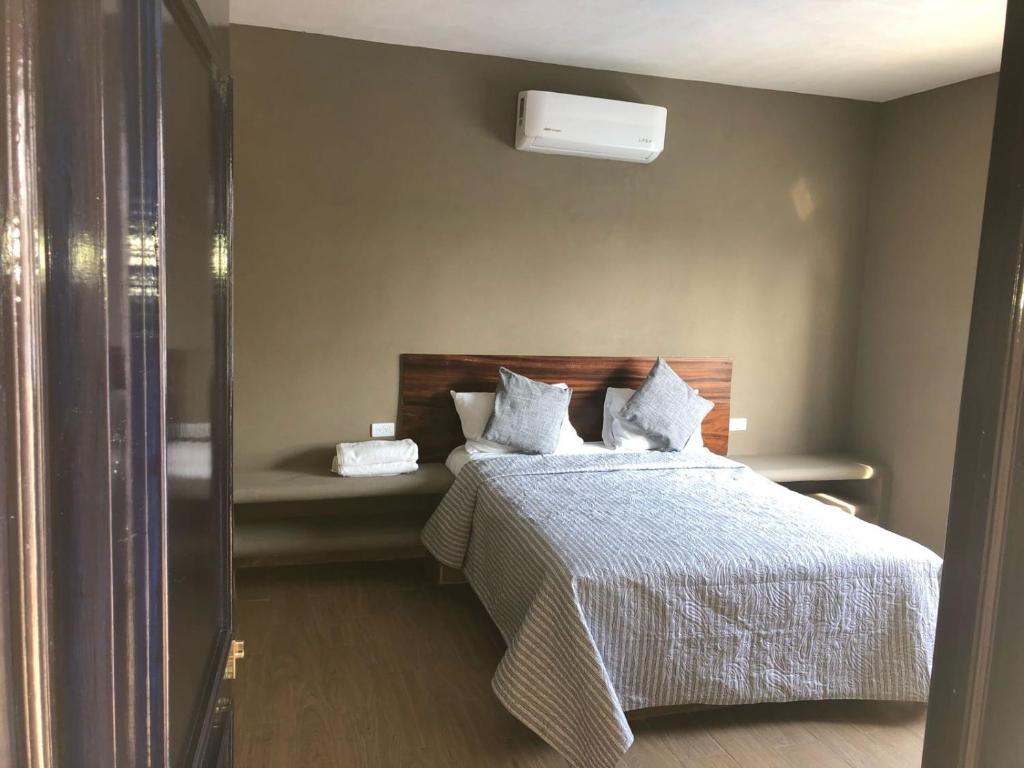 Un pat sau paturi într-o cameră la Casa Maravatío M R