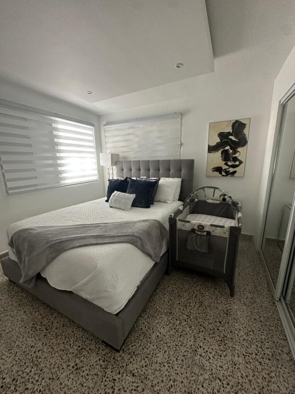 a bedroom with a large bed and a window at Sweet Home in Carolina