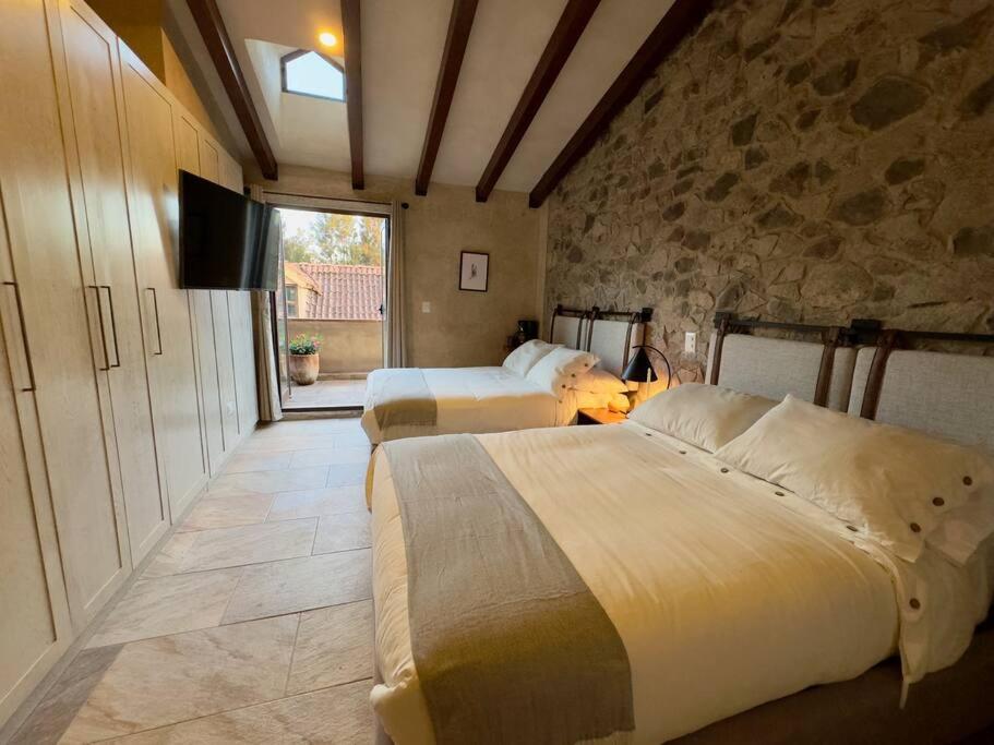 Un pat sau paturi într-o cameră la Loft Mar en ValQuirico Terraza