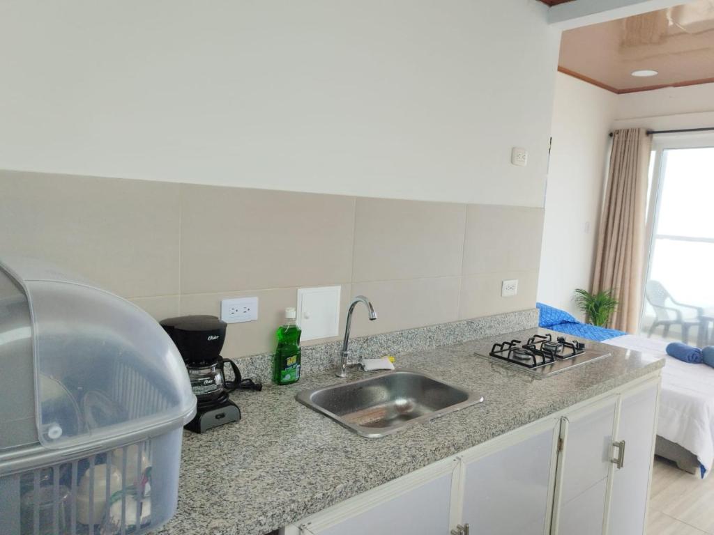 Kuchyň nebo kuchyňský kout v ubytování Sueños en la playa