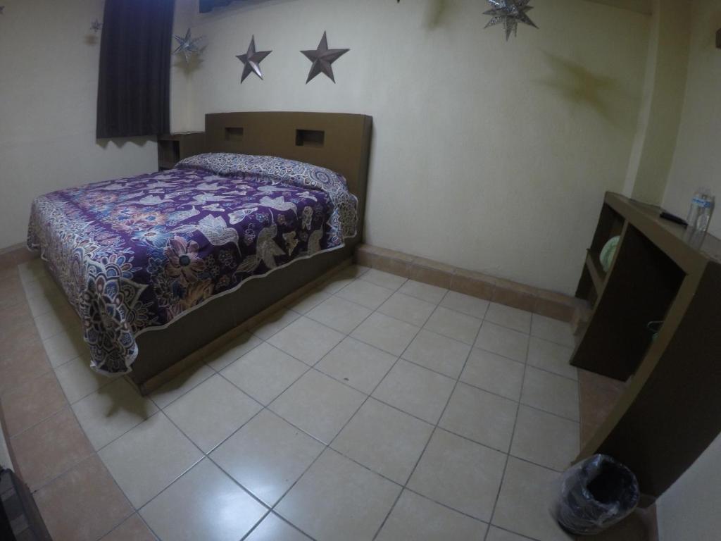 Postel nebo postele na pokoji v ubytování Hospedaje La Mexicana