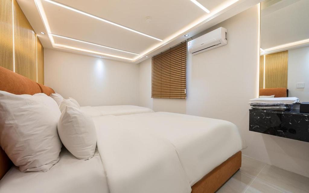 Postel nebo postele na pokoji v ubytování Cheese Hotel Seomyeon