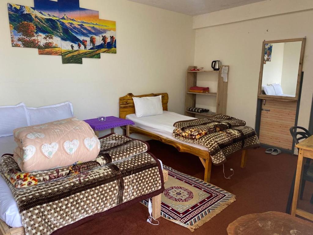 Postel nebo postele na pokoji v ubytování Bloomfield Farmhouse and Eco-Resort