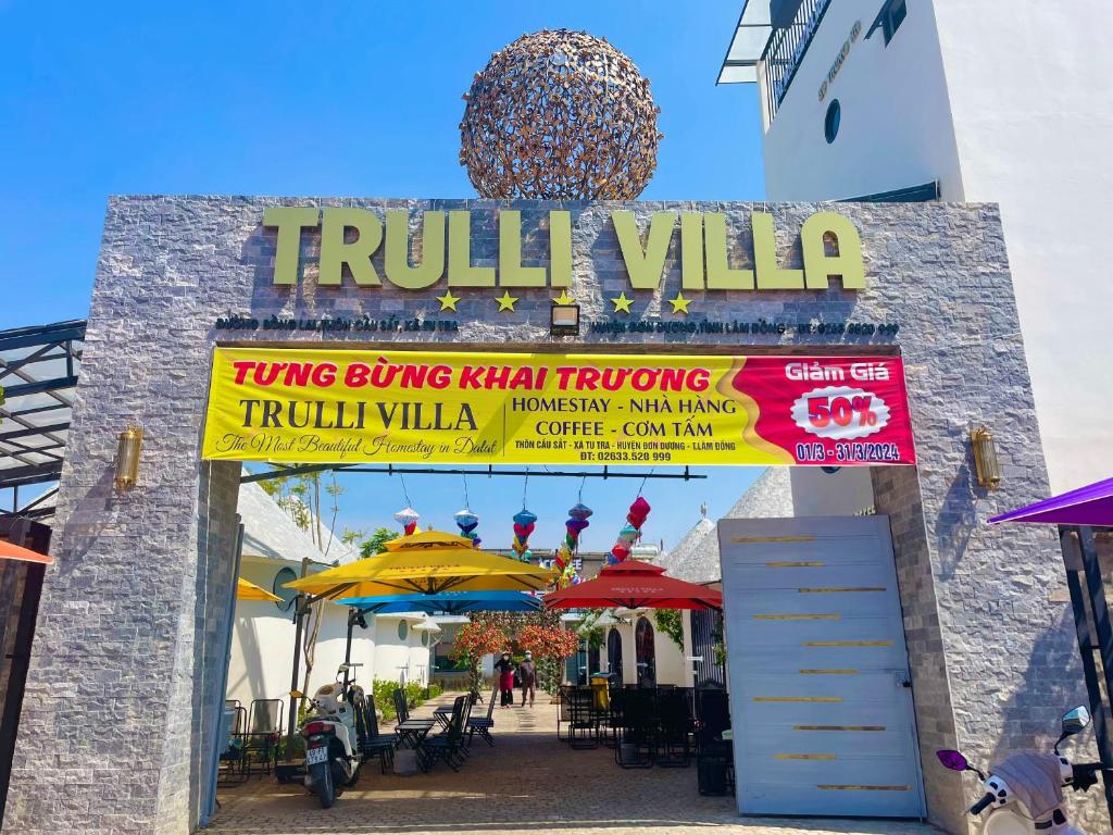 an entrance to a restaurant with a sign that reads truth villa at Trulli Villa Homestay Đà Lạt in Phú Thạnh