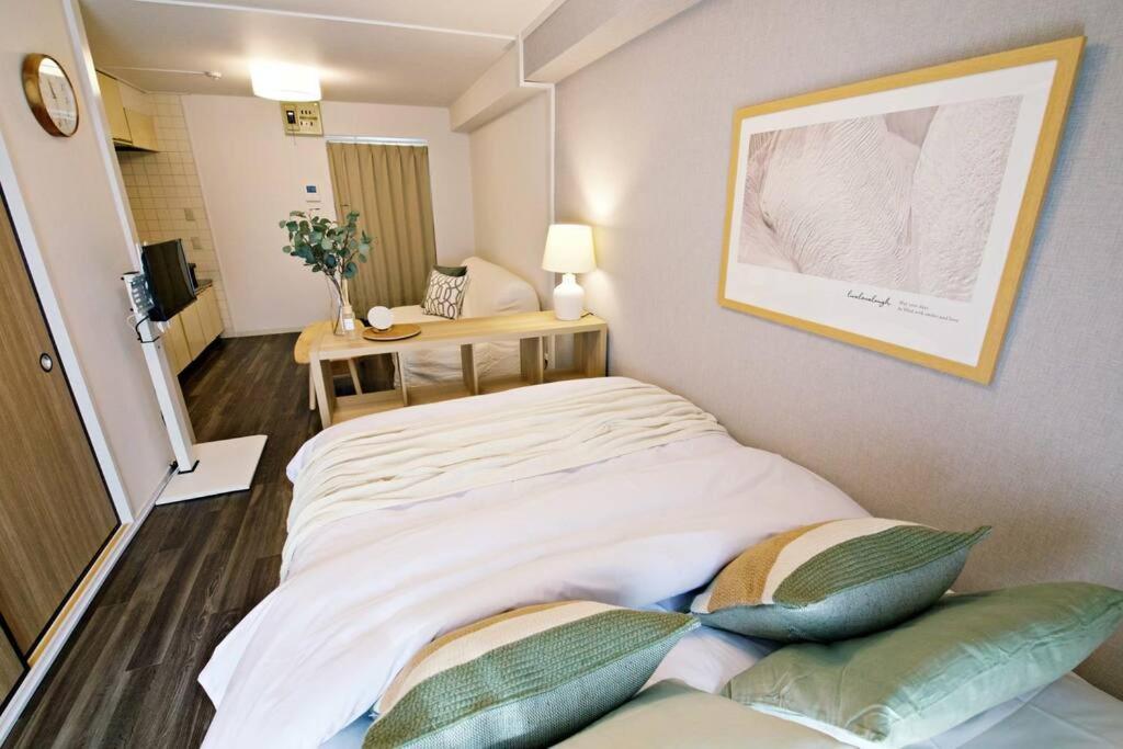 Postel nebo postele na pokoji v ubytování クレストYs千代田7B