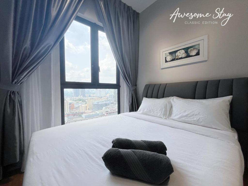 Ліжко або ліжка в номері Sunway Velocity Two By Awesomestay