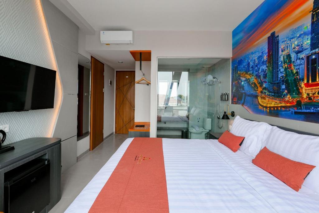 Postel nebo postele na pokoji v ubytování Azana Style Hotel Tulungagung