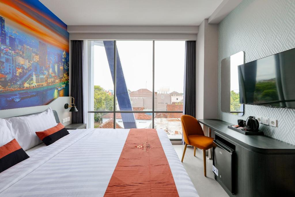 Postel nebo postele na pokoji v ubytování Azana Style Hotel Tulungagung