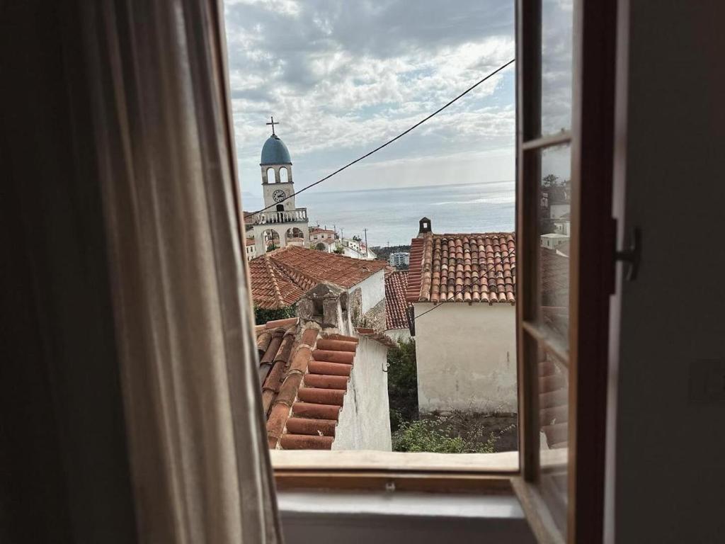 a view from an open window of a church at LION'S VILLA in Vlorë
