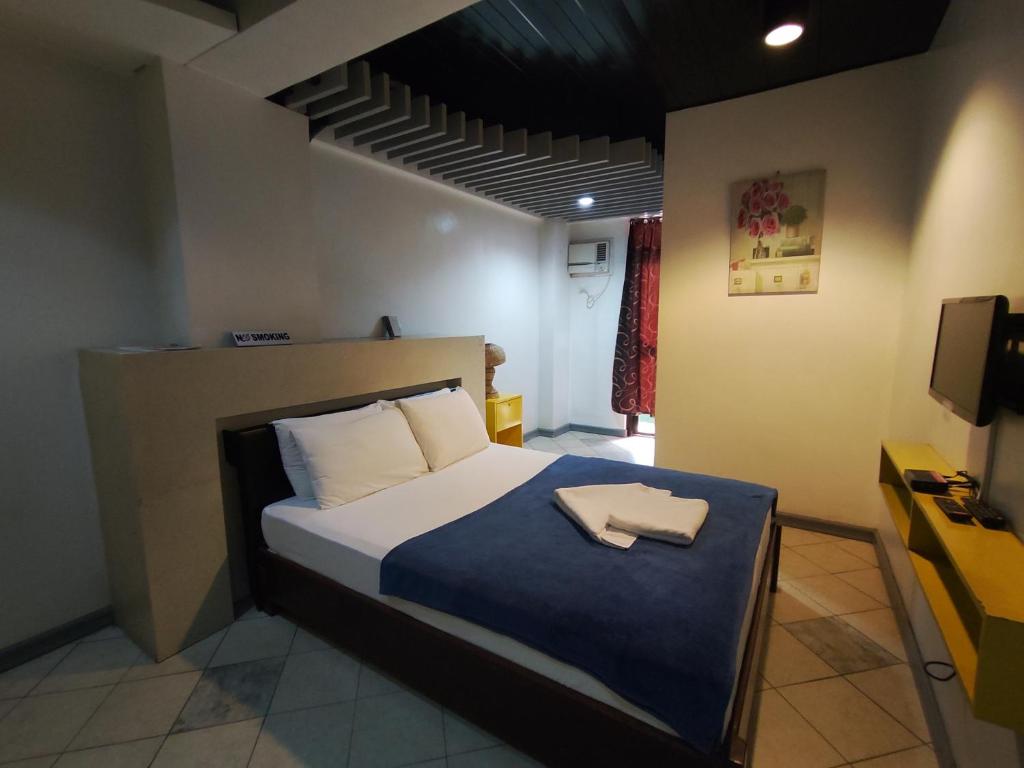 Postel nebo postele na pokoji v ubytování Balai Subik Hotel