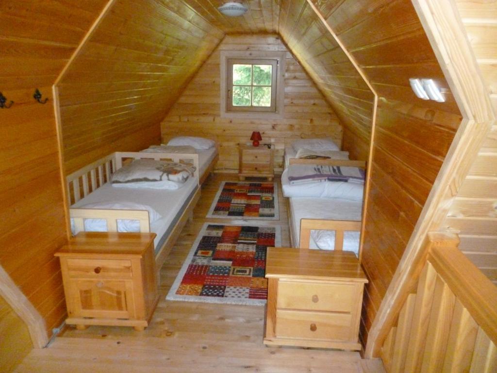 Postel nebo postele na pokoji v ubytování Chalet Bellevue Rogla