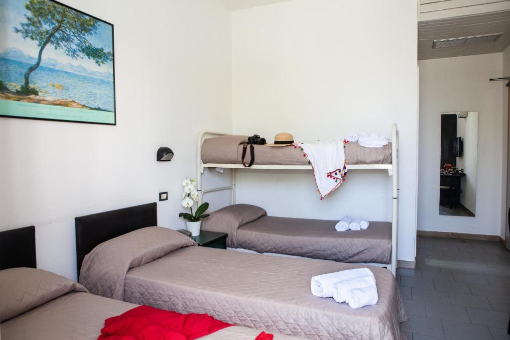 Postel nebo postele na pokoji v ubytování Hotel La Torretta Bramante