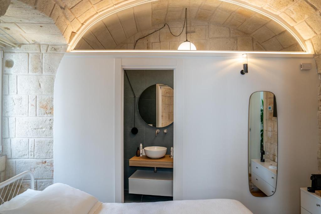 Postel nebo postele na pokoji v ubytování Innesto Rooms - Monopoli