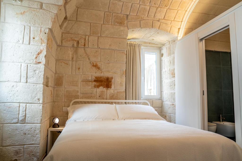Postel nebo postele na pokoji v ubytování Innesto Rooms - Monopoli