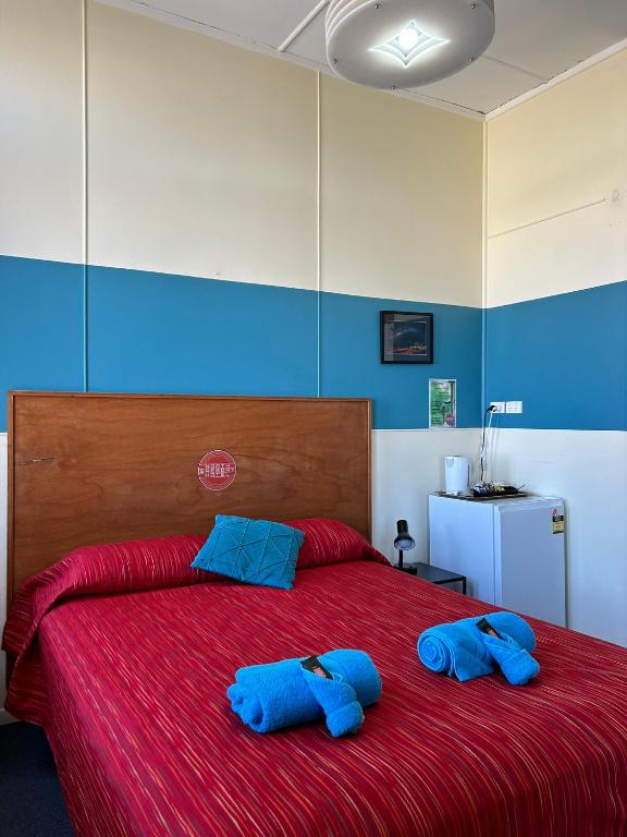 Postel nebo postele na pokoji v ubytování North Gregory Hotel