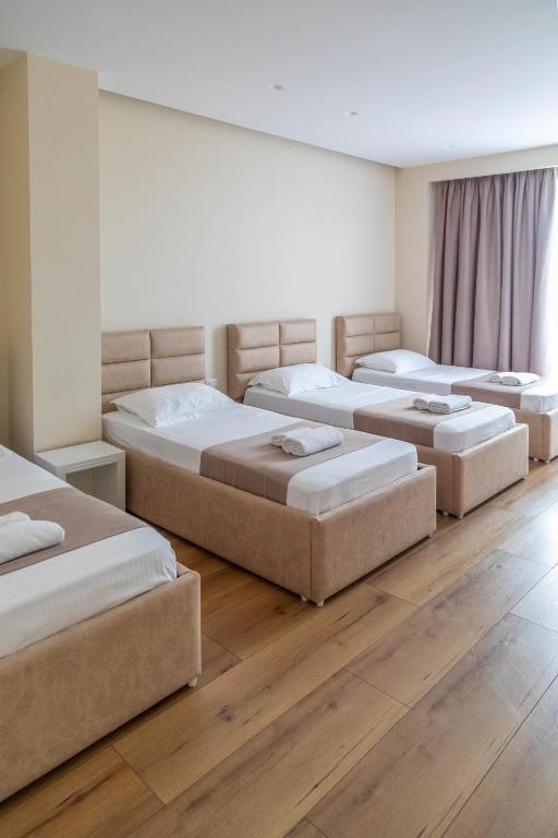 Postel nebo postele na pokoji v ubytování Te Aldo Hotel