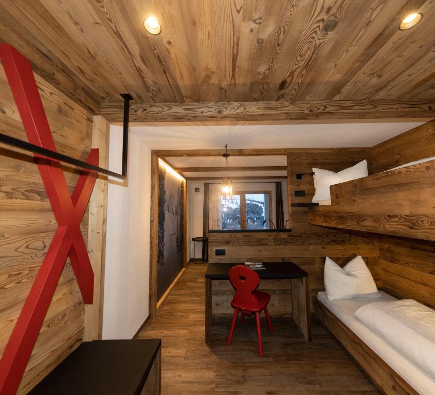 Postel nebo postele na pokoji v ubytování Rifugio Crëp de Munt