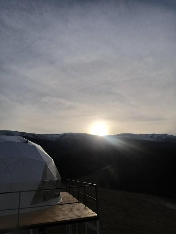 a view of the sun setting over the mountains at Dilijan Glamping in Dilijan