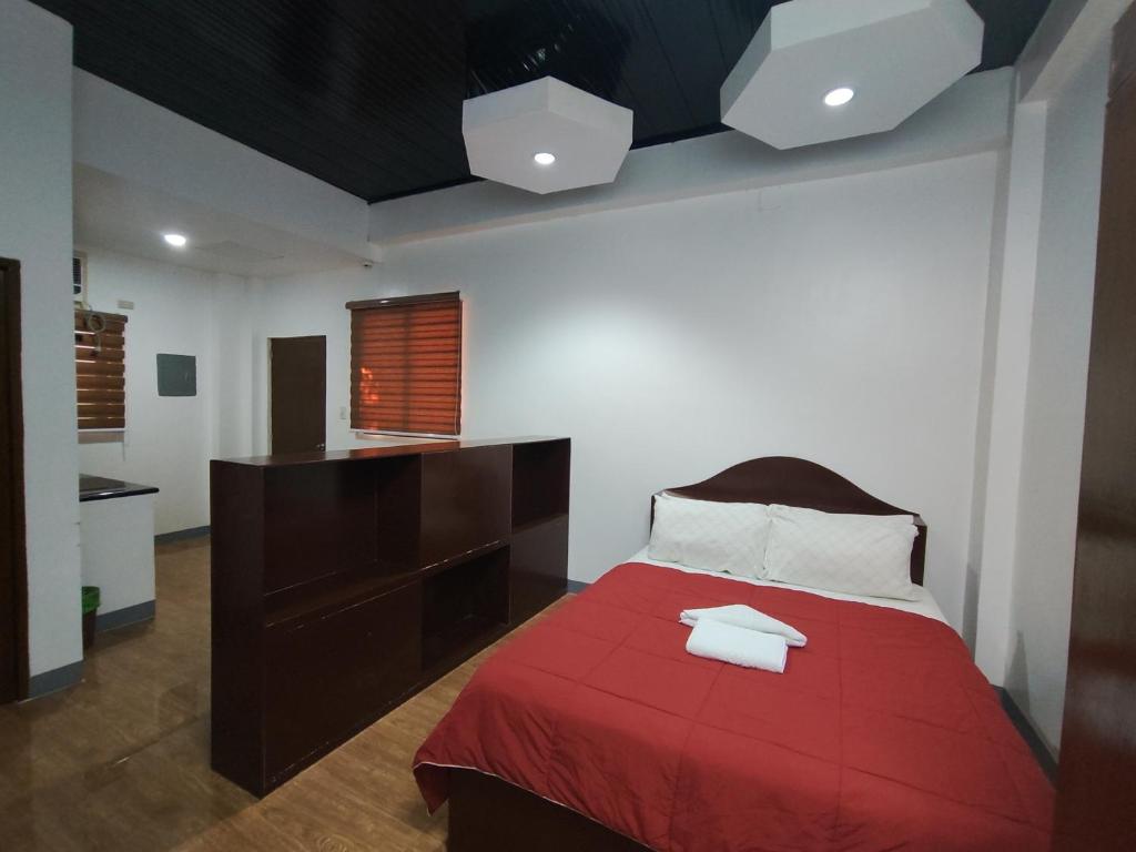Postel nebo postele na pokoji v ubytování Balai Subik Hotel