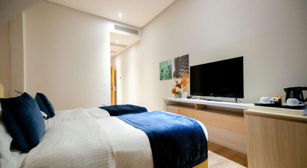 Postel nebo postele na pokoji v ubytování Best Western Premier Ark Hotel