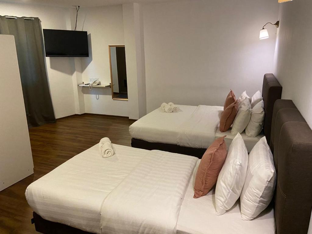 Postel nebo postele na pokoji v ubytování HOTEL LONGHOUSE
