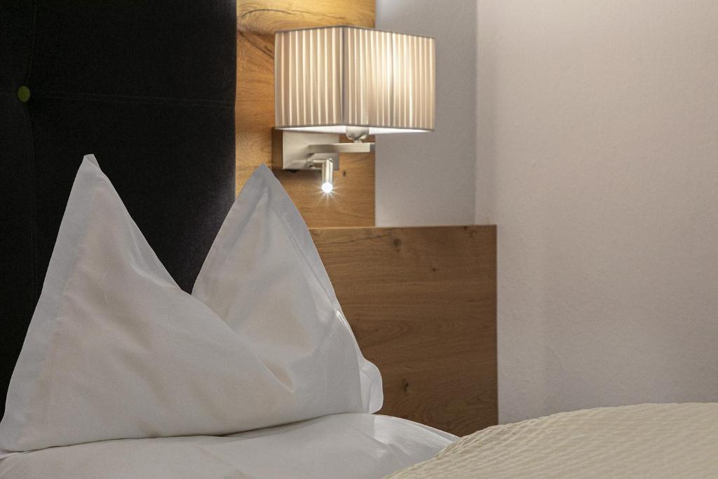 Postel nebo postele na pokoji v ubytování Garni-Hotel Tritscherhof