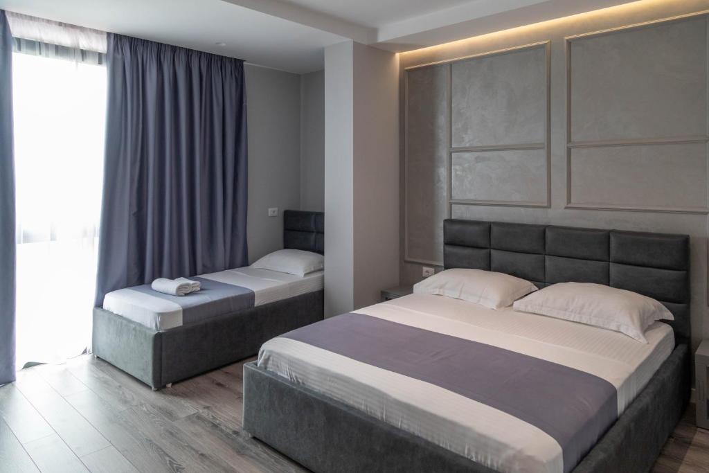 Postel nebo postele na pokoji v ubytování Te Aldo Hotel