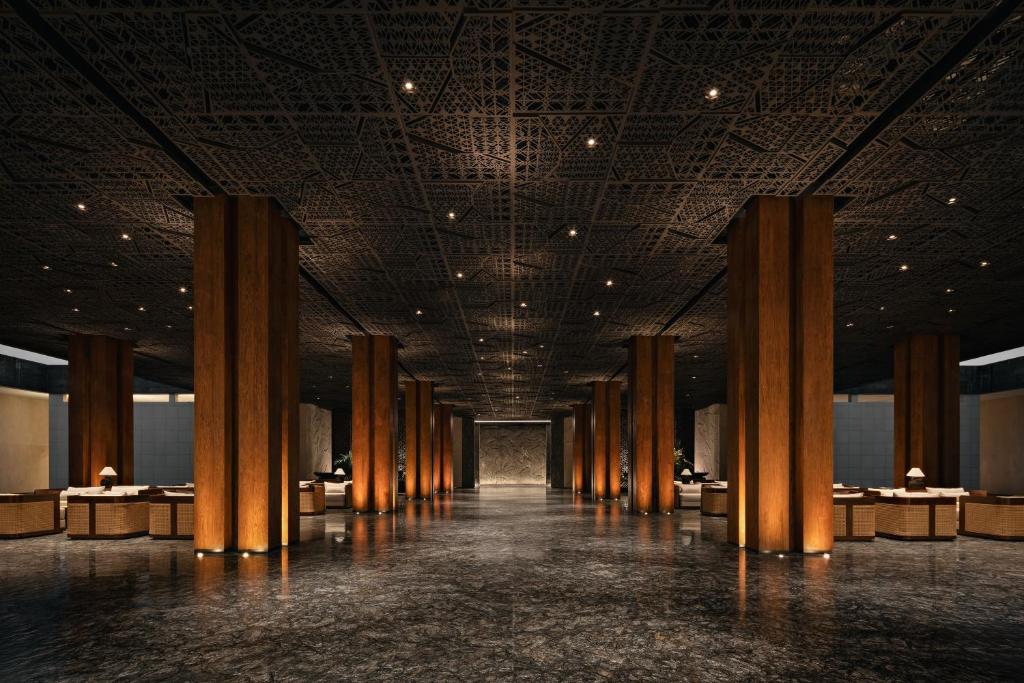 a rendering of a hallway with columns in a building at Bali Beach Hotel in Sanur