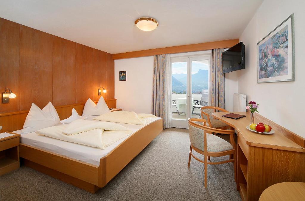 Postel nebo postele na pokoji v ubytování Garni-Hotel Tritscherhof