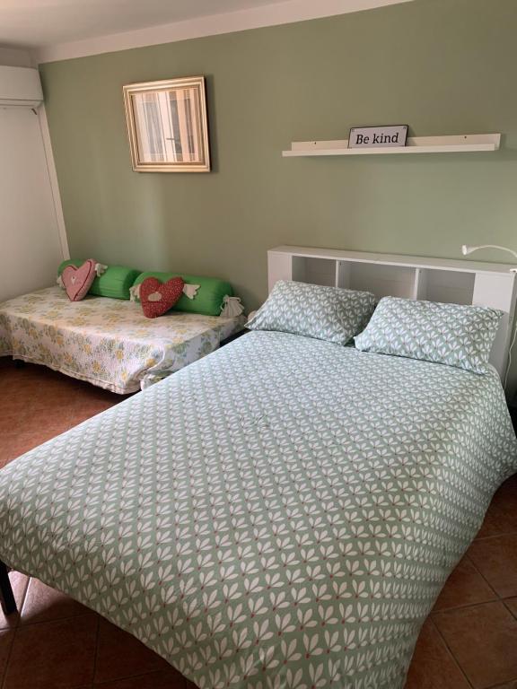 Postel nebo postele na pokoji v ubytování Casamanu